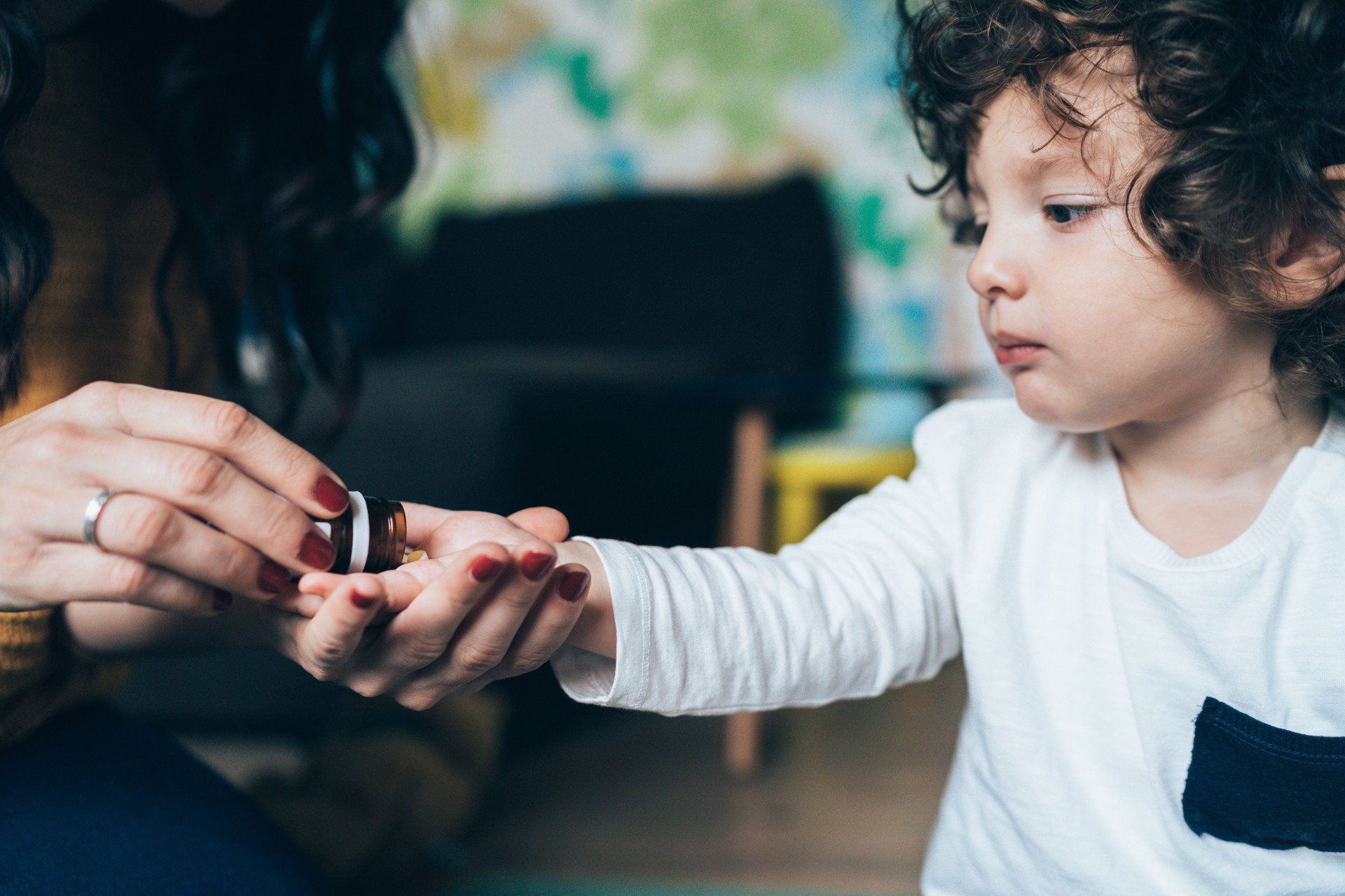 Mother Giving a Medicine to Child