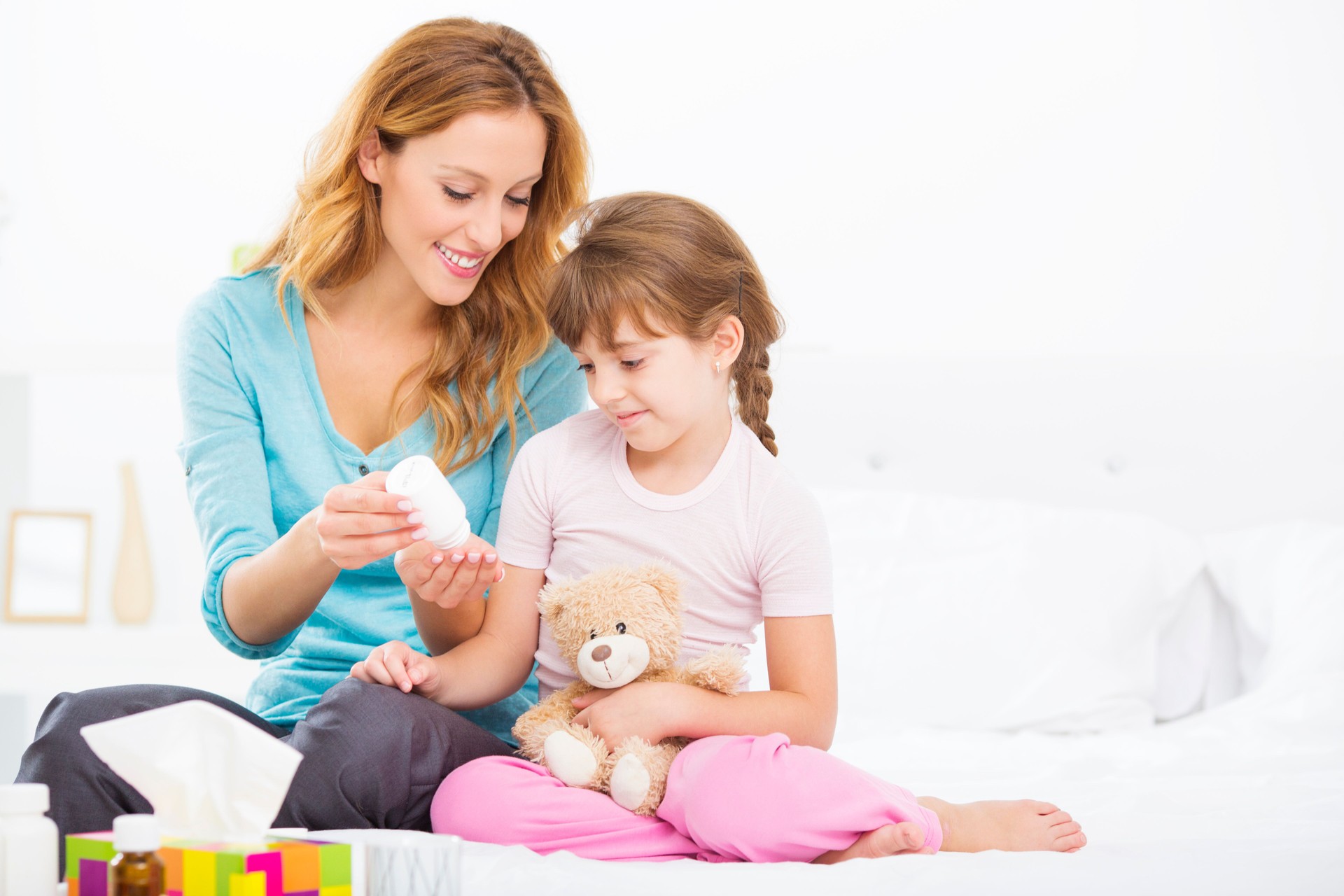 Mother Giving a Medicine to Child.